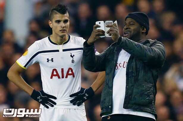 A-spectator-runs-onto-the-pitch-and-takes-a-selfie-of-himself