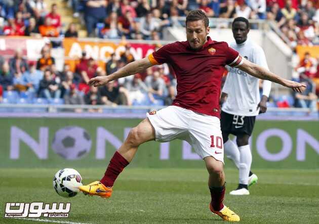 AS Roma's Totti try to control the ball during their Serie A soccer match against Atalanta at the Olympic stadium in Rome