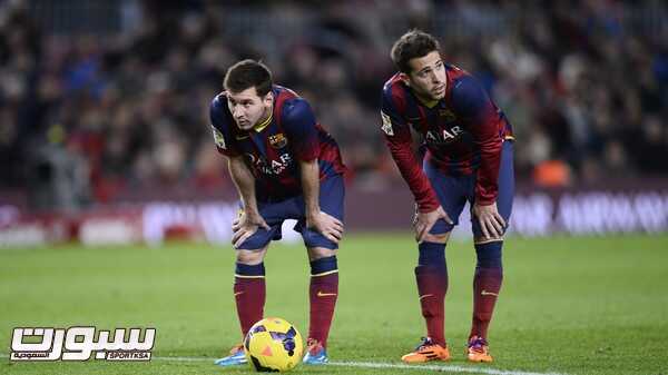 FC Barcelona's Lionel Messi, from Argentina, left, and Jordi Alba look on during a Spanish La Liga soccer match against Malaga at the Camp Nou stadium in Barcelona, Spain, Sunday Jan. 26, 2014. (AP Photo/Manu Fernandez)