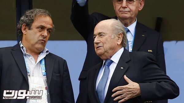 FIFA President Sepp Blatter speaks with UEFA President Michel Platini (L) before the 2014 World Cup Group G soccer match between Germany and Portugal at the Fonte Nova arena in Salvador June 16, 2014.      REUTERS/Darren Staples (BRAZIL  - Tags: SOCCER SPORT WORLD CUP)