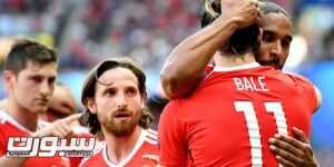 epa05390593 Ashley Williams of Wales (R) and Gareth Bale of Wales celebrate after an own goal by Gareth McAuley of Northern Ireland during UEFA EURO 2016 round of 16 match between Wales and Northern Ireland at Parc des Princes in Paris, France, 25 June 2016. (RESTRICTIONS APPLY: For editorial news reporting purposes only. Not used for commercial or marketing purposes without prior written approval of UEFA. Images must appear as still images and must not emulate match action video footage. Photographs published in online publications (whether via the Internet or otherwise) shall have an interval of at least 20 seconds between the posting.)  EPA/GEORGI LICOVSKI   EDITORIAL USE ONLY