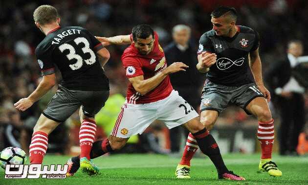 epa05500448 Manchester United's Henrikh Mkhitaryan (C) in action against Southampton's Matt Targett (L) and Southampton's Dusan Tadic during the English Premier League soccer match between Manchester United and Southampton at Old Trafford, Manchester, Britain, 19 August 2016.  EPA/PETER POWELL No use with unauthorized audio, video, data, fixture lists, club/league logos or 'live' services. Online in-match use limited to 75 images, no video emulation. No use in betting, games or single club/league/player publications   EDITORIAL USE ONLY  EDITORIAL USE ONLY