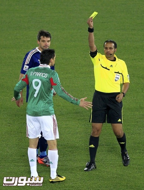Referee Al Ghamdi of Saudi Arabia shows yellow card to Mexico's Franco during a 2010 World Cup soccer match against France at Peter Mokaba stadium in Polokwane