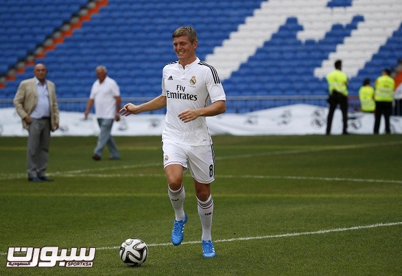 New Real Madrid midfielder Kroos of Germany controls the ball during his presentation at Santiago Bernabeu stadium in Madrid