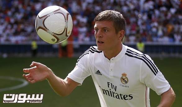 New Real Madrid midfielder Kroos of Germany controls the ball during his presentation at Santiago Bernabeu stadium in Madrid